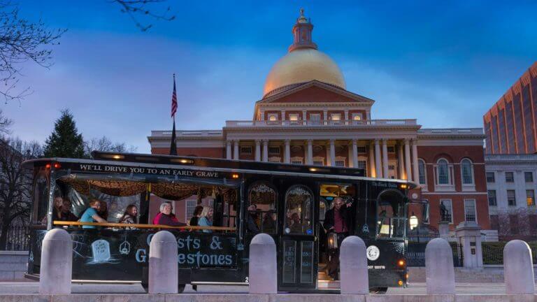 boston state house with haunted trolley in front