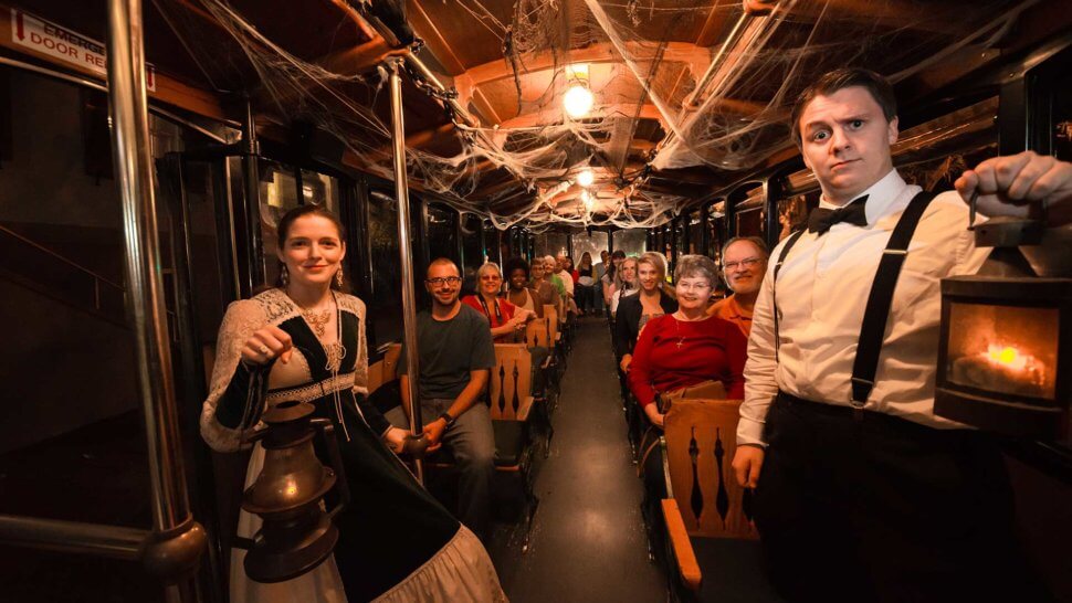 inside savannah haunted tour trolley with tour guides