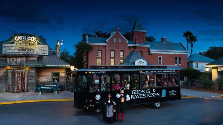 st augustine ghost tour guides in front of black trolley