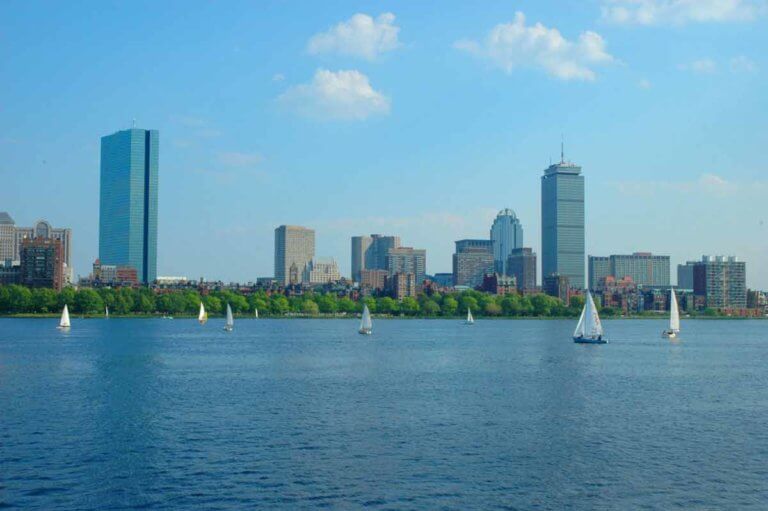 Boston's Back Bay, several sailboats and a view of a portion of the skyline