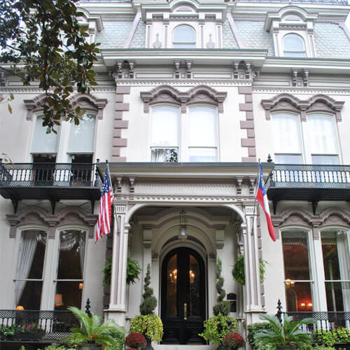 The exterior of the elegant Hamilton Turner Inn, a three-story building done in the Victorian style in Savannah