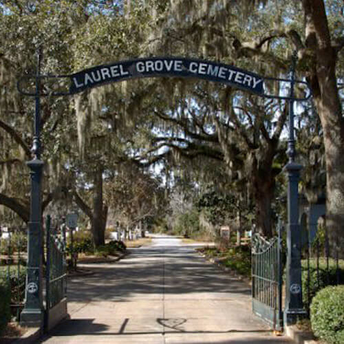 The entrance to the Laurel Grove Cemetery under a canopy of Spanish Moss in Savannah