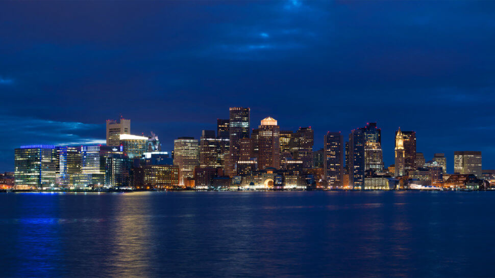 Skyline view of Boston at night during a Boston ghost tour