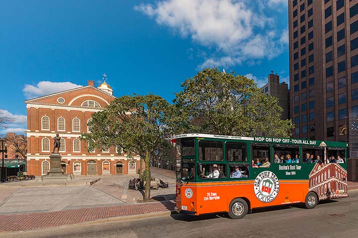 Boston trolley driving past Faneuil Hall