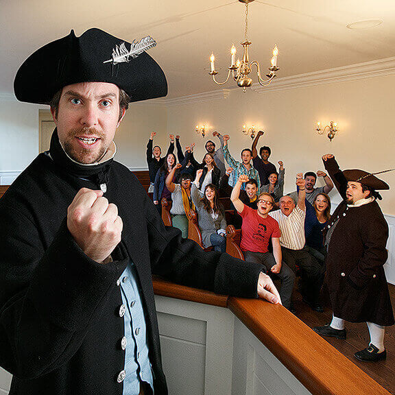 Costumed guide and guests at Boston Tea Party Ships & Museum