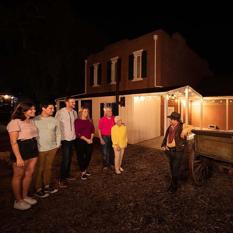 San Diego ghost tour guests and host outside of the Whaley House