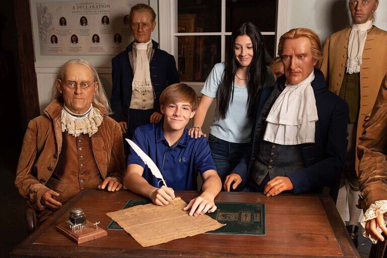 Guests at St. Augustine Potter's Wax Museum forefathers exhibit