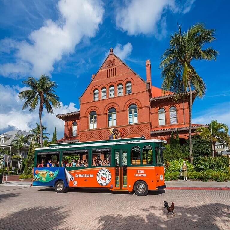 key west trolley driving past customs house