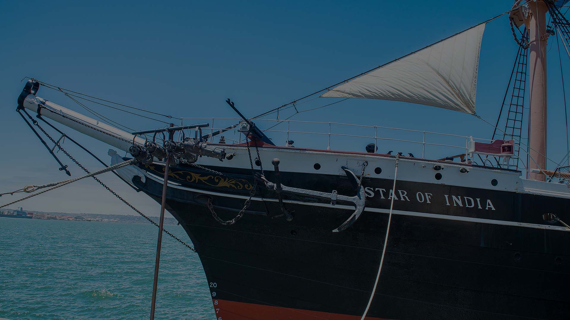 The Star of India ship sailing on the ocean with billowing sails.