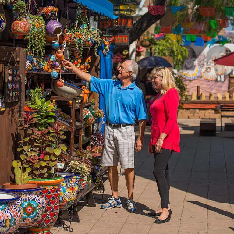 Shoppers exploring the lively streets of San Diego, surrounded by trendy shops