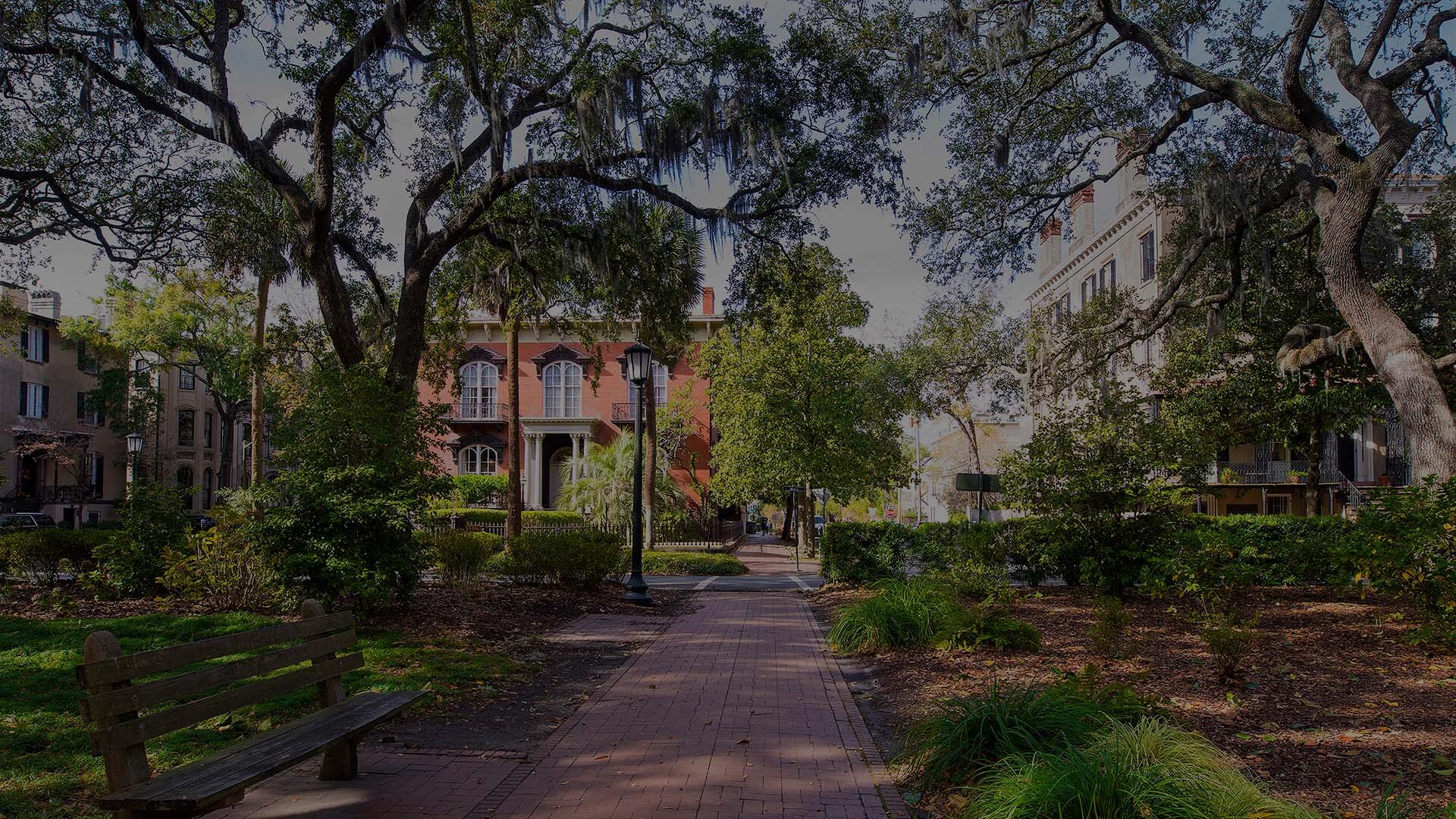 Monterey Square with vibrant foliage and elegant historic structures