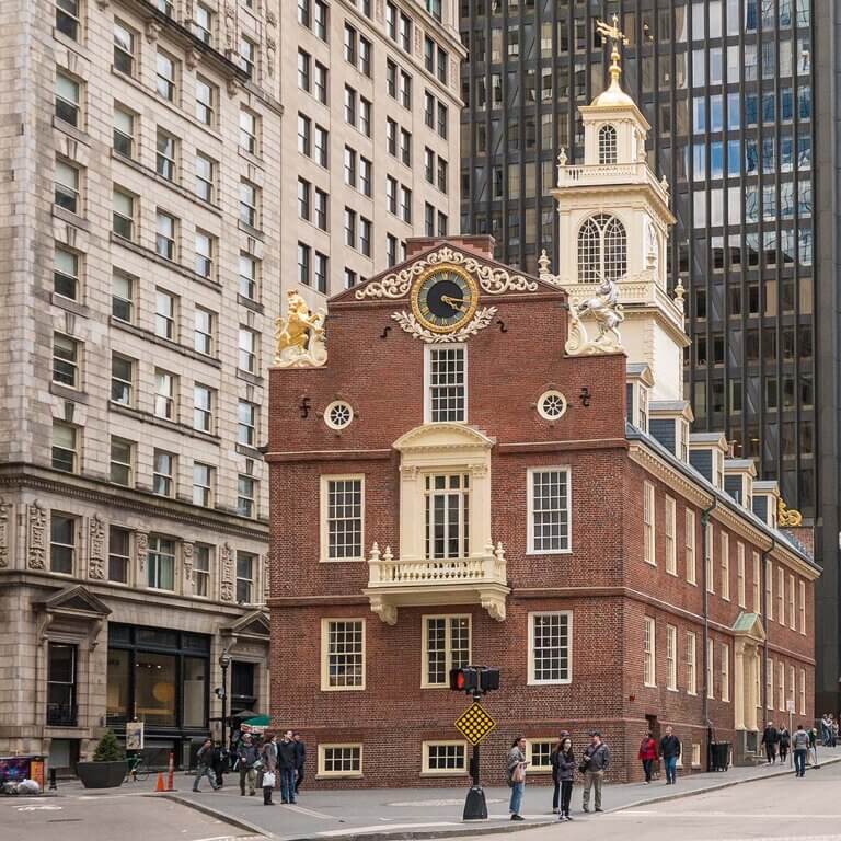 Historic Old State House building with brick facade and clock tower in downtown Boston