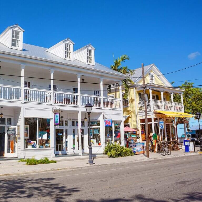 Duval Street bustling with activity, featuring eclectic shops