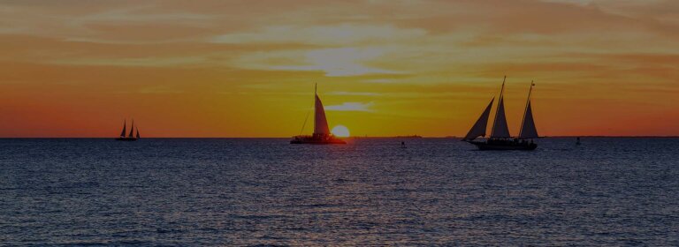 A vibrant sunset over Key West, showcasing its unique blend of culture, history, and stunning natural beauty