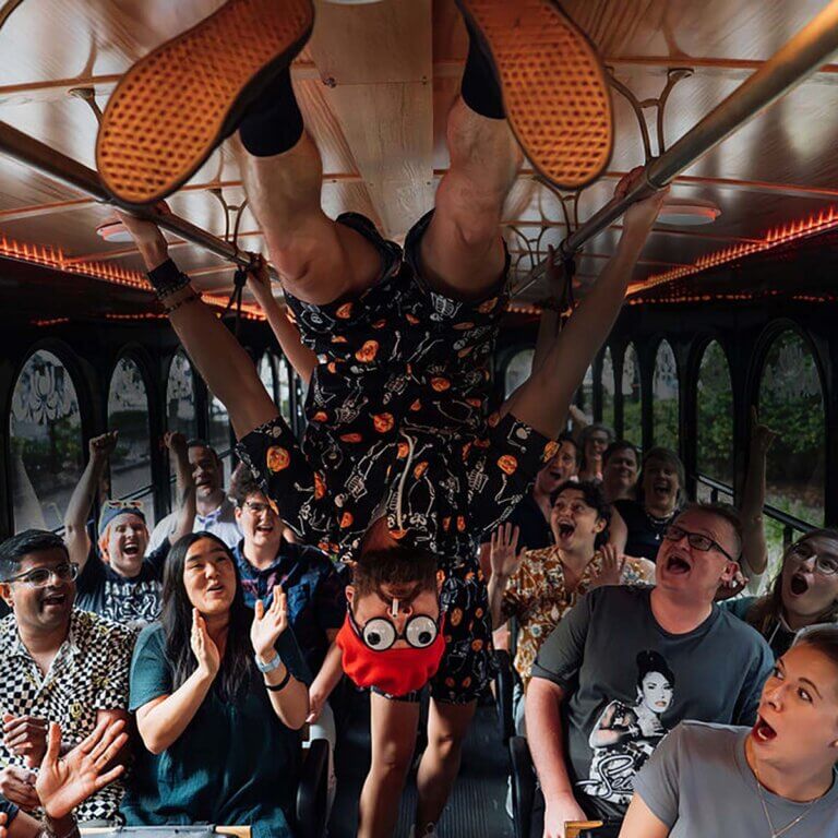 Savannah Ghost Tours for Morons guide and guests inside trolley