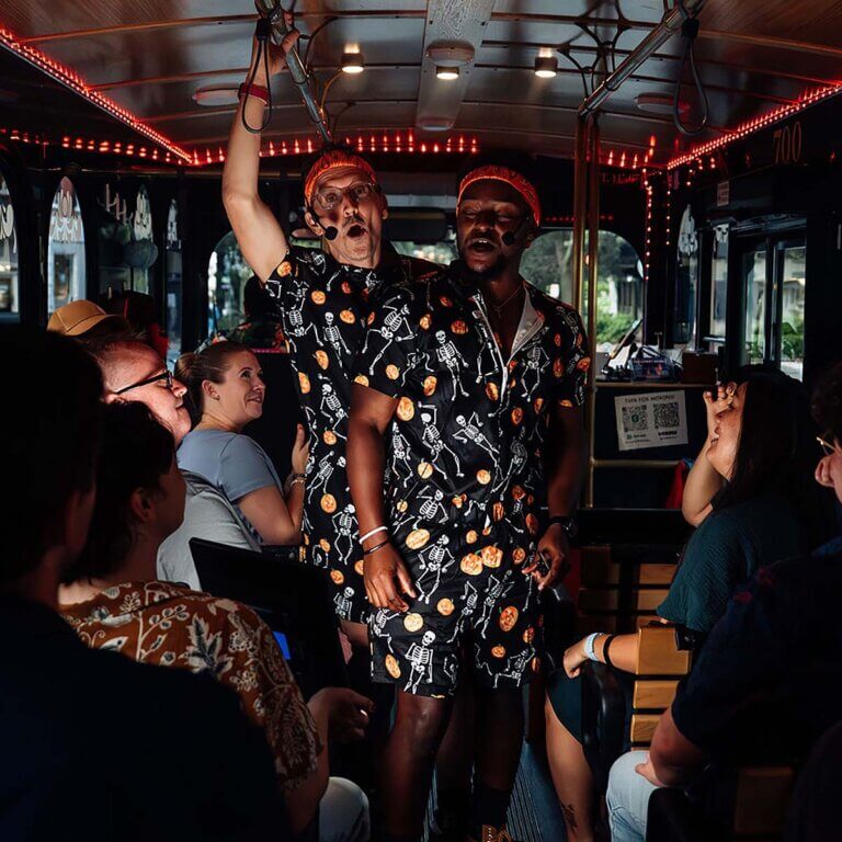 Savannah Ghost Tours for Morons guide and guests inside trolley