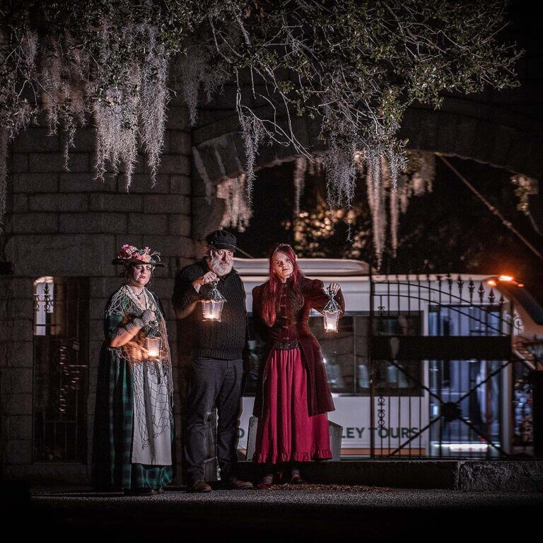 Charleston Ghosts & Gravestones hosts at Bethany Cemetery with tour vehicle in the background